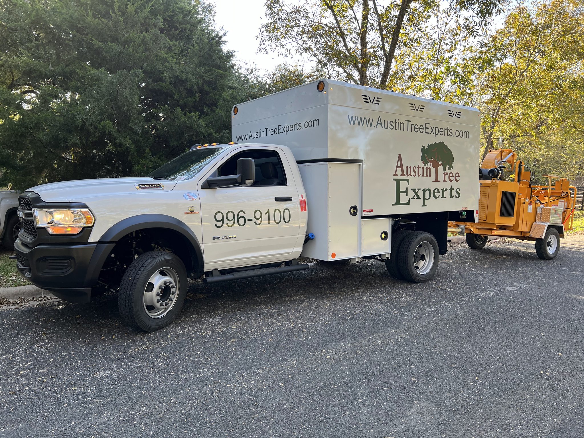 Austin Tree Experts Ram chip truck with professional wood chipper