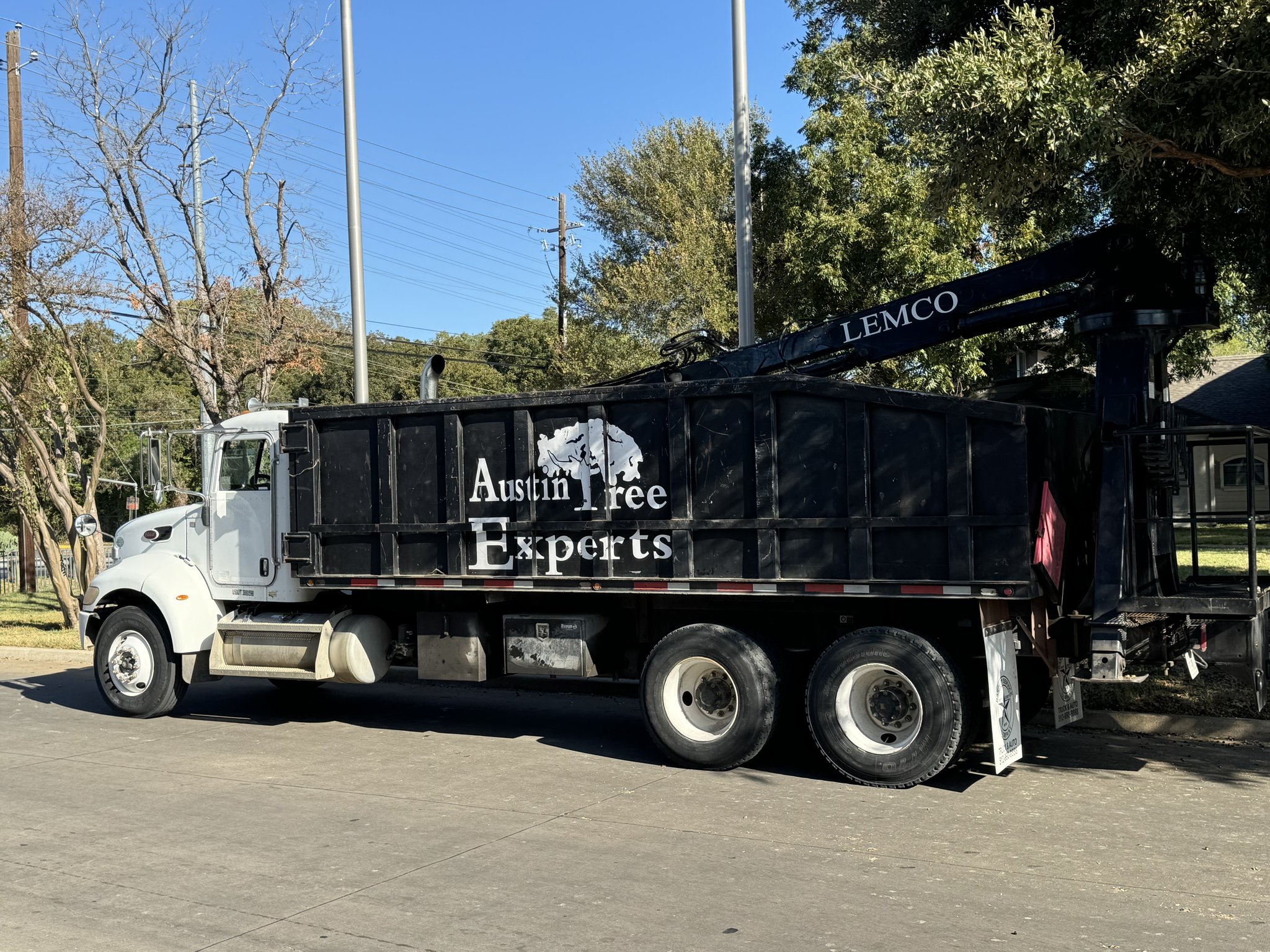 Austin Tree Experts grapple truck with LEMCO hydraulic arm for debris removal