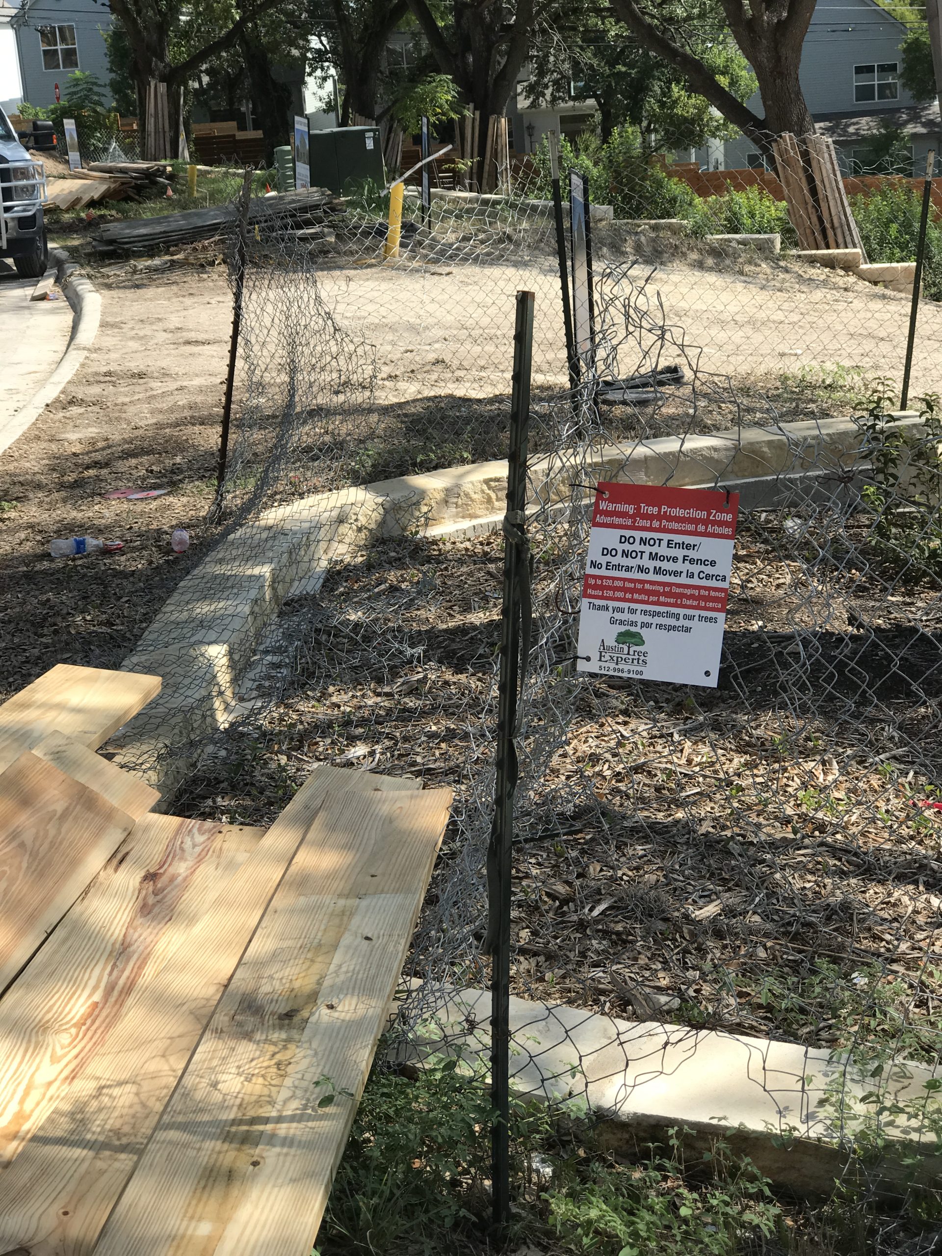 Home Page 12 Austin Tree Experts tree protection fencing with signage at construction site